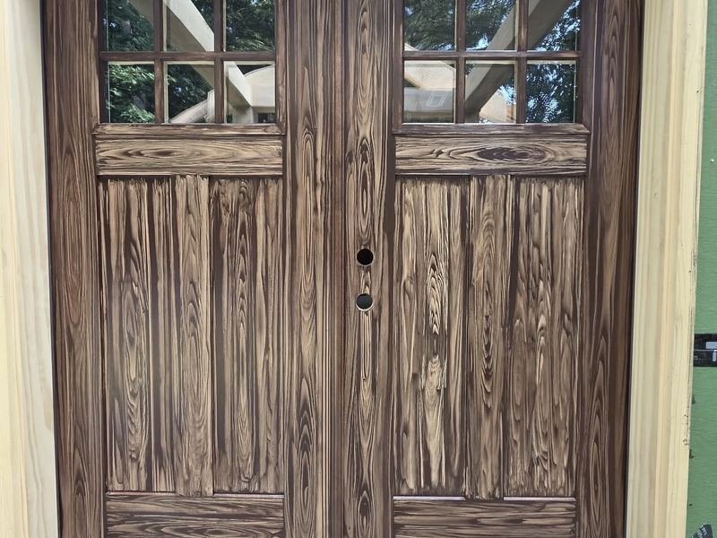 Wood-grain double doors finished on site