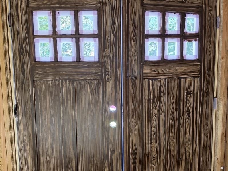 Wood-grain finished double doors, installed