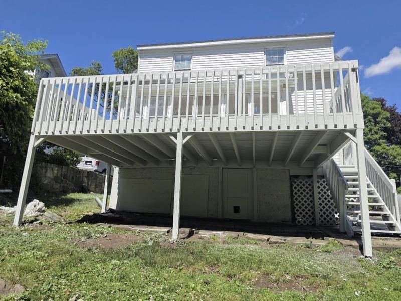 Elevated deck and railings painted white