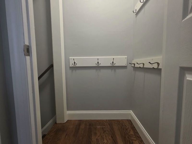 Closet with new hardwood floor and painted trim
