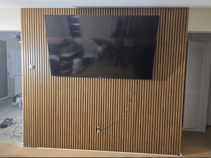 Wood slat accent wall for a media area