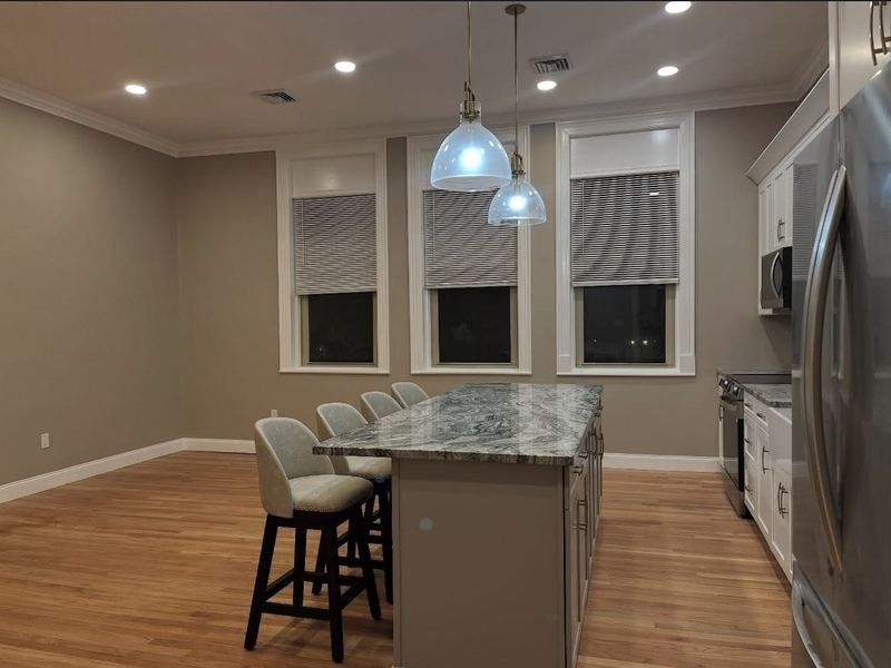 Kitchen with painted walls and hardwood floors